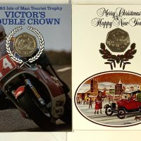 3 Pobjoy Mint Isle of Man Christmas cards inset with 50p coins, 1980, 1983, 1984 together with a 1983 Victory TT double crown 50p