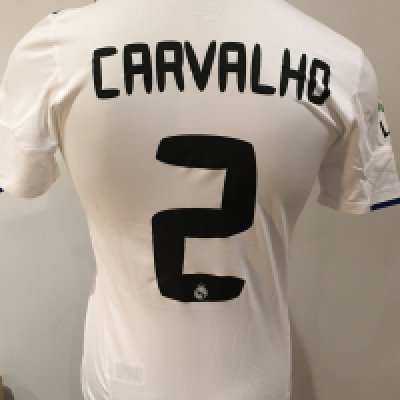 Real Madrid 2010 - 2011 Match Worn Football Shirt: White short sleeve shirt with La Liga badge to sleeves. Carvalho 2 to rear. Worn during the league campaign. 