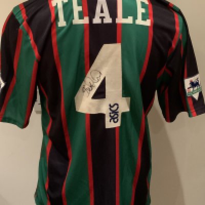 Aston Villa Match Worn Football Shirt: Green and black short sleeve shirt with Premier League badges to sleeves. Teale 4 to rear. Signed to the number by the player.