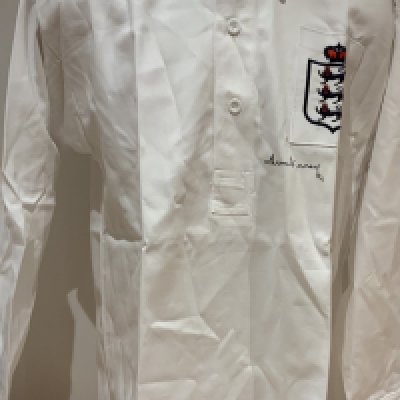 To Finney England Signed Replica Shirt: Collated old style retro shirt signed to front by Tom Finney. COA from reputable source. 