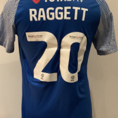 Portsmouth 2022 - 2023 Match Worn Football Shirt: Blue short sleeve shirt with FA Cup badging to sleeve. Raggett 20 to rear. Worn v Tottenham on 7 January 2023. 