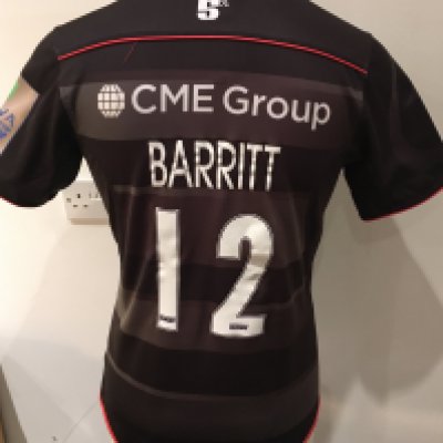 Saracens 2016 - 2017 Home Match Worn Rugby Union Football Shirt: Black short sleeve BLK large excellent condition shirt worn by Brad Barritt. Aviva Champions 2015/16 badging. GPS tracking pocket present at neck.
