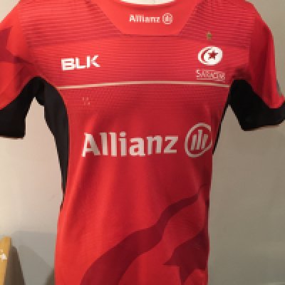 Saracens 2016 - 2017 Away Match Worn Rugby Union Football Shirt: Red short sleeve BLK XL excellent condition shirt worn by Michael Rhodes. Aviva Champions 2015/16 badging. GPS tracking pocket present at neck 