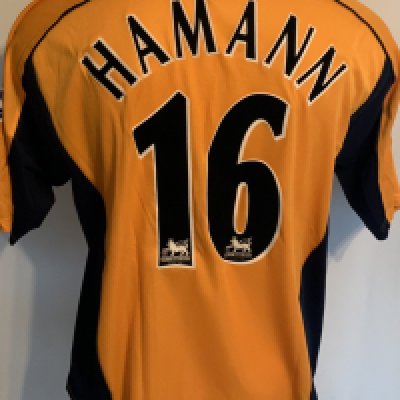 Liverpool 2001 FA Cup Final Match Issued Football Shirt: Gold short sleeve  Reebok shirt with FA Cup badging to sleeves and embroidered to front with FA Cup Final 2001. Hamann 16 to rear. Issued for the Cup Final v Arsenal. Match day programme and press photo is included. Hamann played in the final which Liverpool won. This was the first FA Cup final not played at Wembley since 1922 excluding replays. 