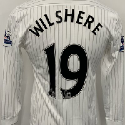 Arsenal 2009 - 2010 3rd Kit Match Issued Football Shirt: White long sleeve pin striped Nike shirt with Premier League badging to sleeves. Wilshere 19 to rear. 
