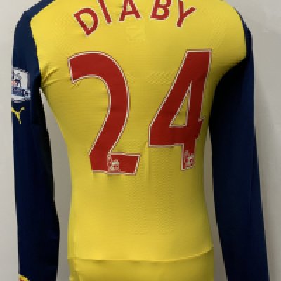 Arsenal 2014 - 2015 Home Match Worn Football Shirt: Yellow long sleeve Nike shirt with Premier League badging to sleeves. Diaby 24 to rear.