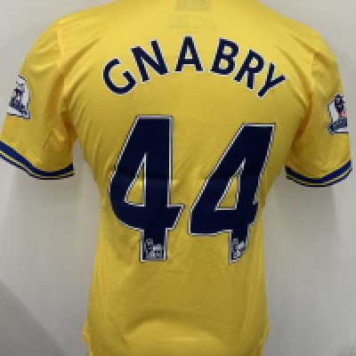 Arsenal 2013 - 2014 Away Match Issued Football Shirt: Yellow short sleeve Nike shirt with Premier League badging to sleeves. Gnabry 44 to rear. 