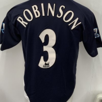 West Brom 2004 - 2005 Match Worn Football Shirt: Blue red and white short sleeve shirt with number 3 Robinson to rear. Premier League badging to sleeves. Signed to front by the player. 
