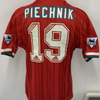 Liverpool 1993 - 1994 Match Issued Signed Football Shirt: Red Carlsberg Adidas short sleeve shirt with green and white trim. Number 19 Piechnik to rear. Signed by 23 team mates to front of the Denmark International. 