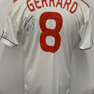Liverpool 2009 - 2010 Match Worn Signed Football Shirt: White Carlsberg Adidas short sleeve shirt with Champions League badging. Number 8 Gerrard to rear. Signed and dedicated to rear by Gerrard. Worn v Fiorentina. 
