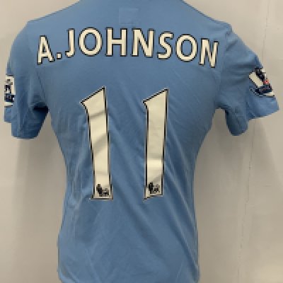 Manchester City 2009 - 2010 Johnson Match Worn Football Shirt: Blue short sleeve Umbro shirt from 1st season of Etihad Sponsorship. Premier League badging to sleeve and A Johnson 11 to rear. 