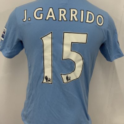 Manchester City 2009 - 2010 Garrido Match Worn Football Shirt: Blue short sleeve Umbro shirt from 1st season of Etihad Sponsorship. Premier League badging to sleeve and J Garrido 15 to rear. 