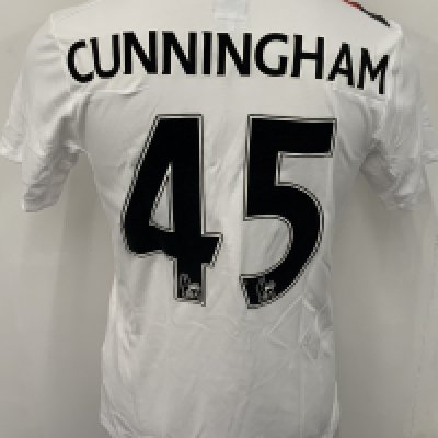Manchester City 2009 - 2010 Cunningham 3rd Kit Match Issued Football Shirt: White with red and black slash short sleeve Umbro shirt from 1st season of Etihad Sponsorship. No badging to sleeve and Cunningham 45 to rear. Possibly issued/worn in pre season friendly. 