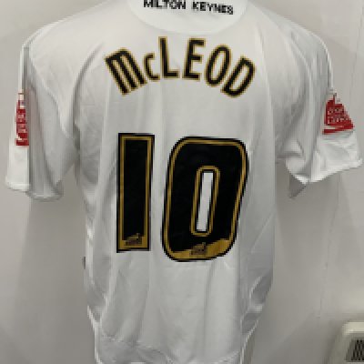 MK Dons 2006 - 2007 Match Worn Football Shirt: White short sleeve Marshall sponsored shirt with Coca Cola Football League badging to arms. Number 10 McLeod to rear. Worn v Tottenham in the Coca Cola Cup.