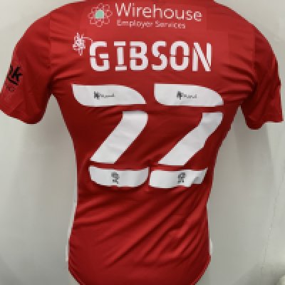 Morecambe 2021 - 2022 Match Worn Football Shirt: Red short sleeve shirt. Number 22 Gibson to rear. FA Cup sleeve badging. Worn v Spurs on 9 January 2022.