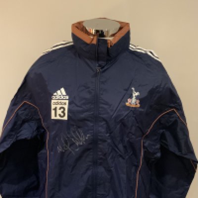 Tottenham 2000 - 2001 Football Players Training Kit: Number 13 used by Neil Sullivan. Comprises of rain jacket which is signed by Sullivan plus blue Adidas Holsten sweatshirt and matching white tee shirt. (3)