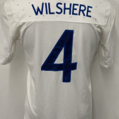 England 2010 - 2011 Wilshere Match Issued England Football Shirt: White short sleeve Umbro shirt with number 4 Wilshere to rear. Issued v Denmark on 9 February 2011. 