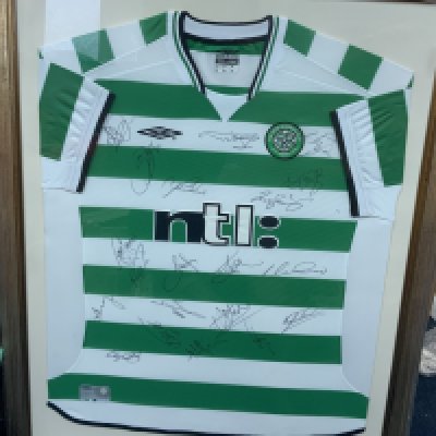 Celtic 2002 - 2003 Framed Multi Signed Football Shirt: Green and white hooped XL shirt. Squad signed with COA. Also comes with signed pennant. Frame measures approximately 38 inches by 31 inches. Not for posting. (2)