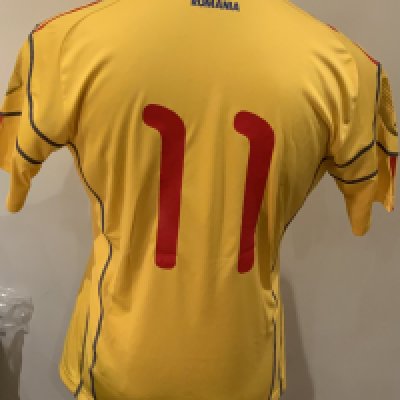 Romania Match Worn Football Shirt: Yellow short sleeve shirt with number 11 to rear. Worn v Italy on 17 November 2010 by Gabriel Torje in a friendly match that ended 1-1.