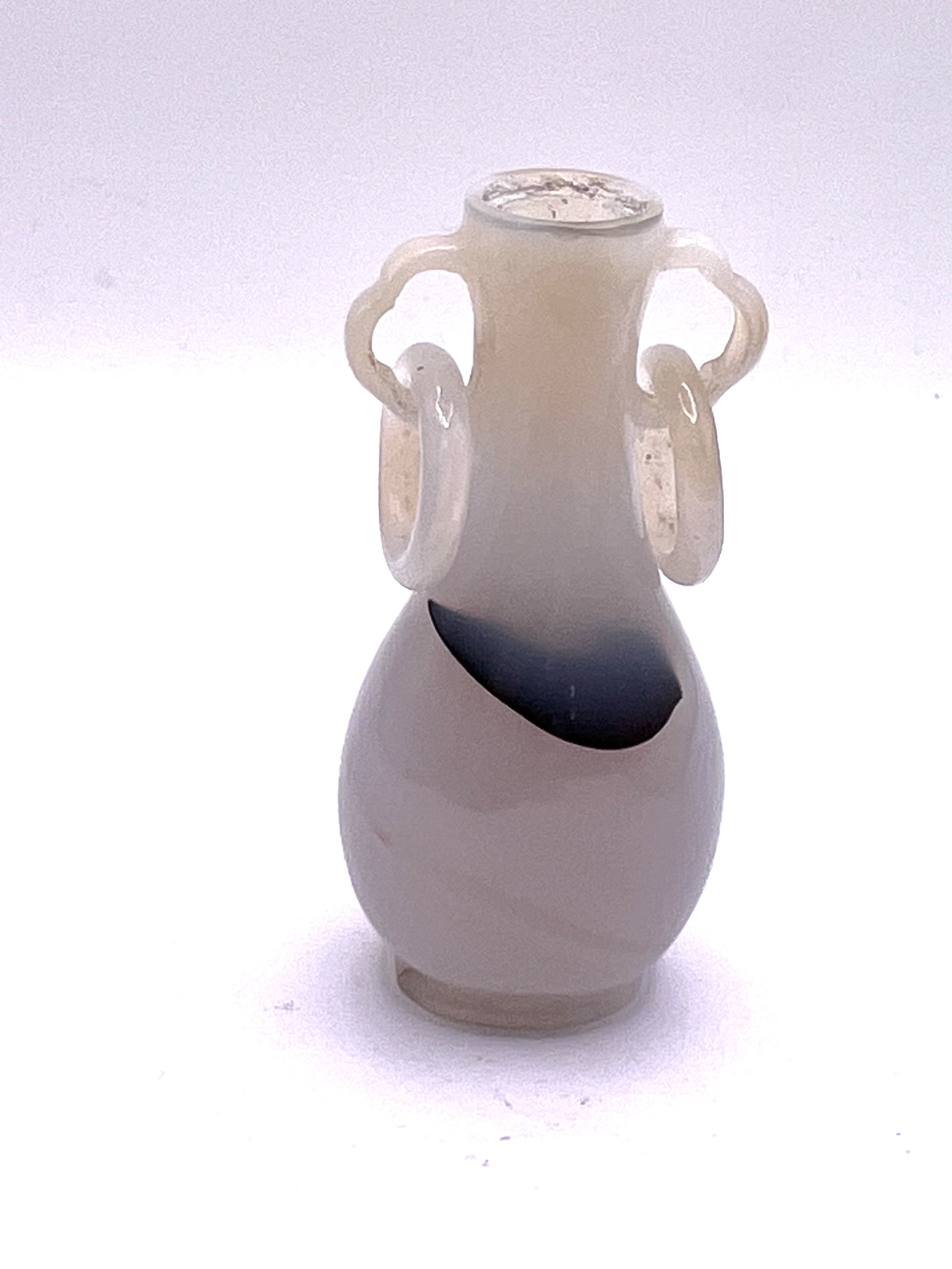 A fine Chinese carved white agate snuff bottle with integral carved rings to shoulders. 7cm