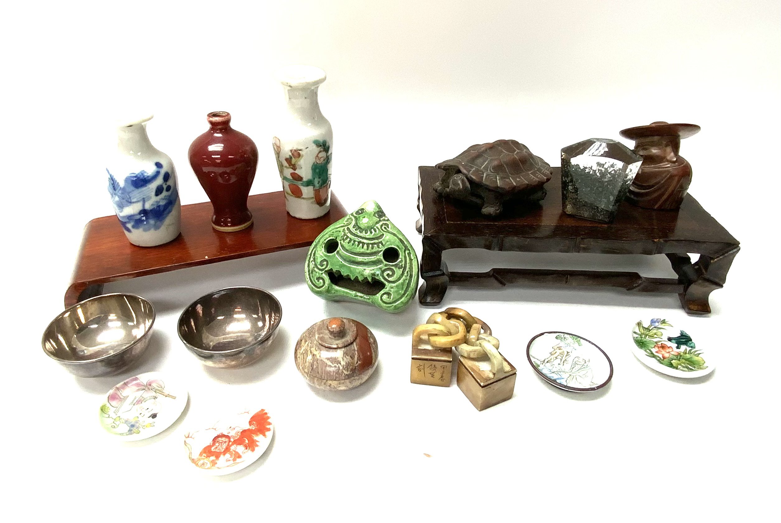 A small colllection of mixed Chinese items to include snuff trays, White metal snuff bowls, miniature vases, Yi-Xiang terracotta model of a tortoise, soapstone chain seal etc.