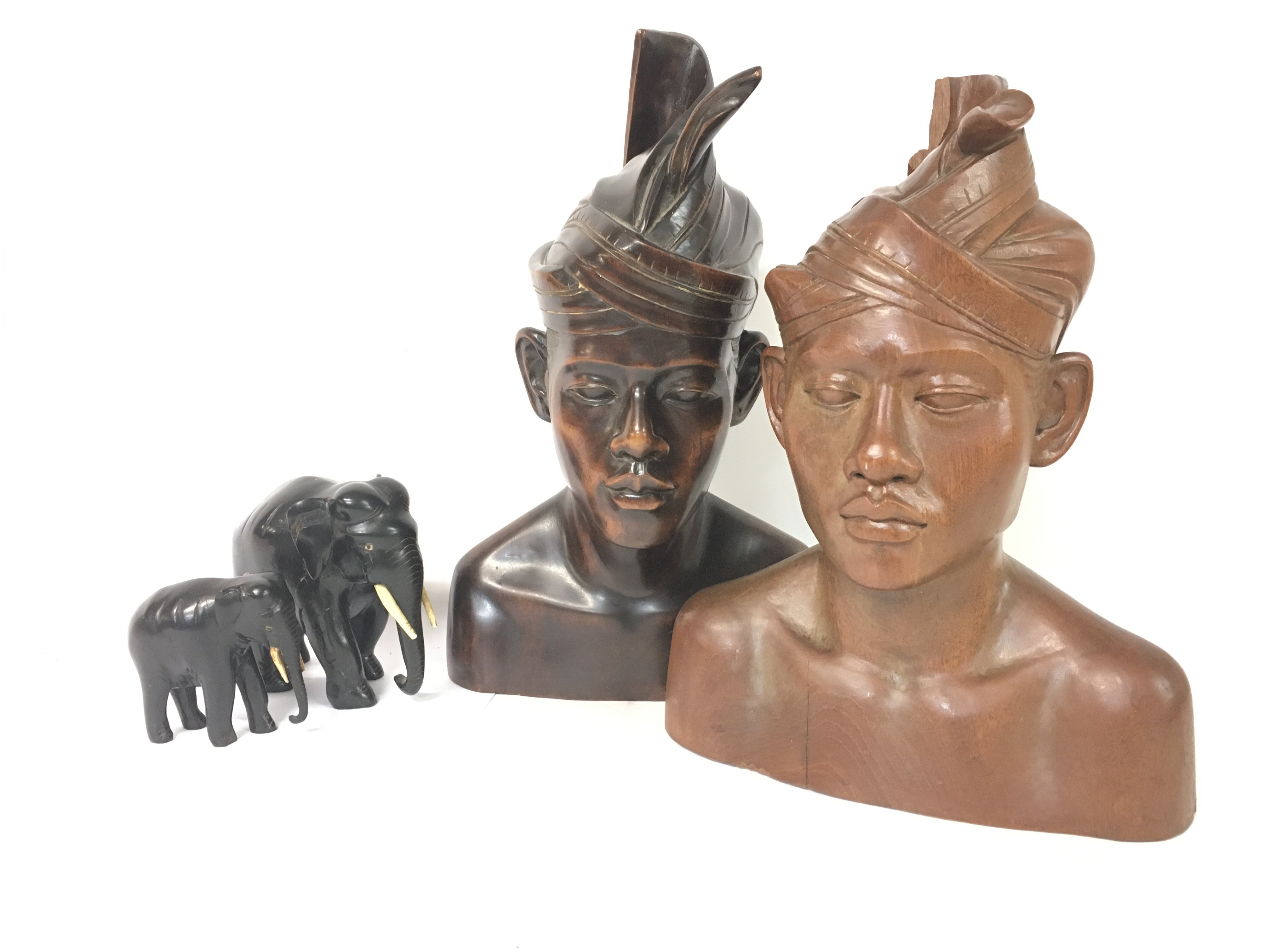 Indonesian carved busts (approximately 35cm tall) and ebony elephants (15 & 9cm tall) NO RESERVE