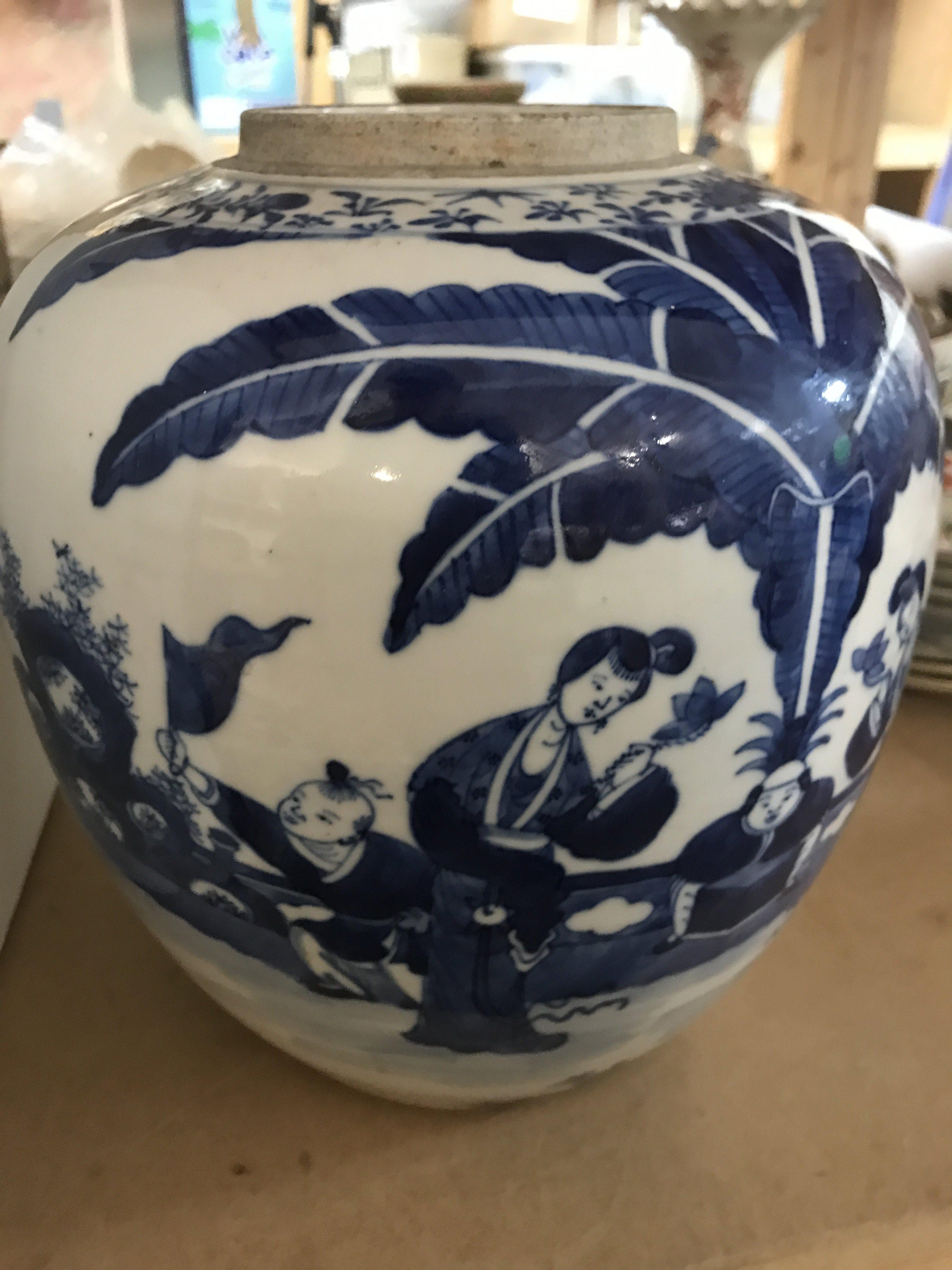 A Chinese ginger jar decorated with various figures within grounds. 28 cm ..