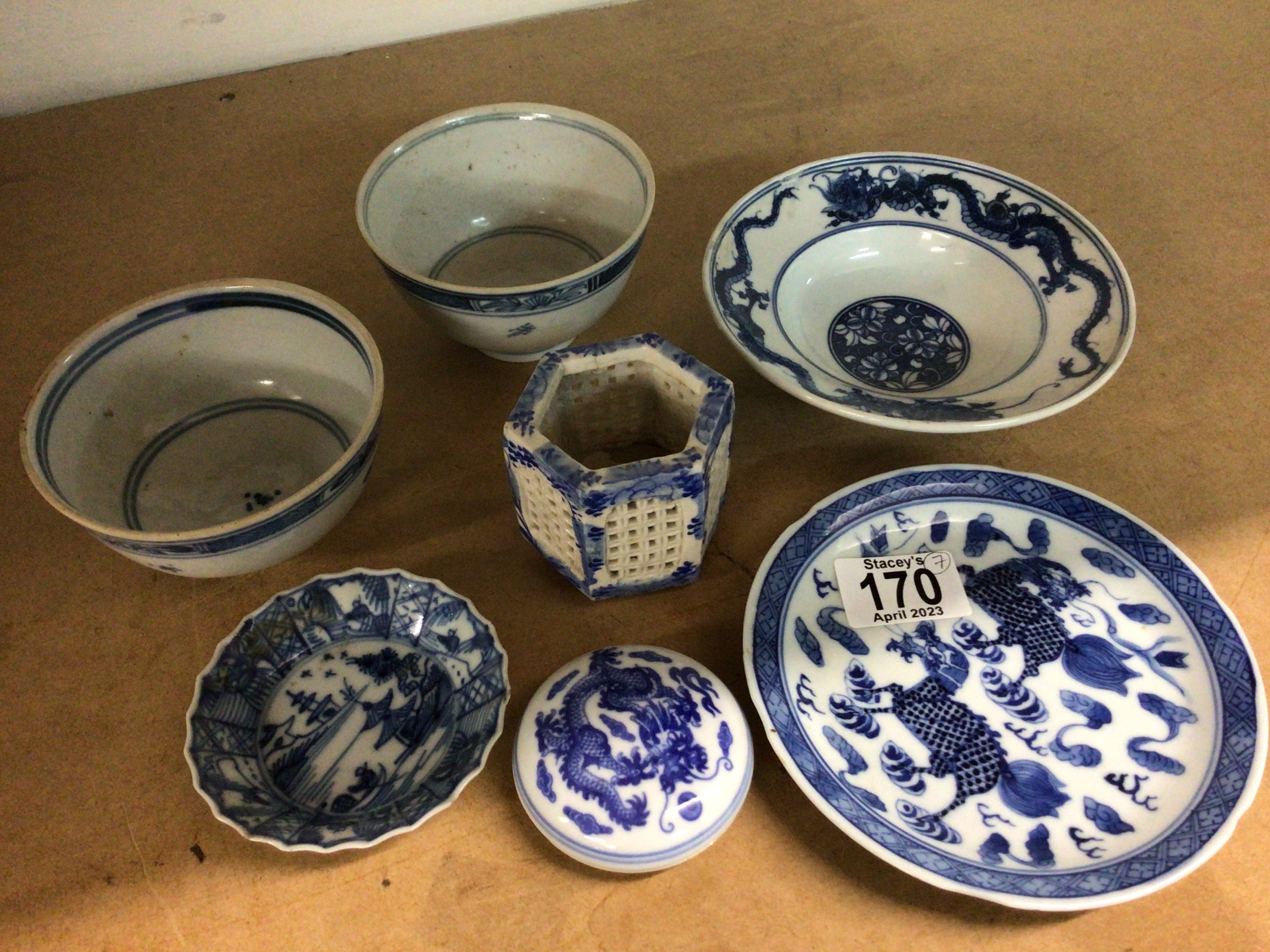 A collection of Chinese blue and white porcelain including two bowls, three dishes, jar and cover and a cricket cage
