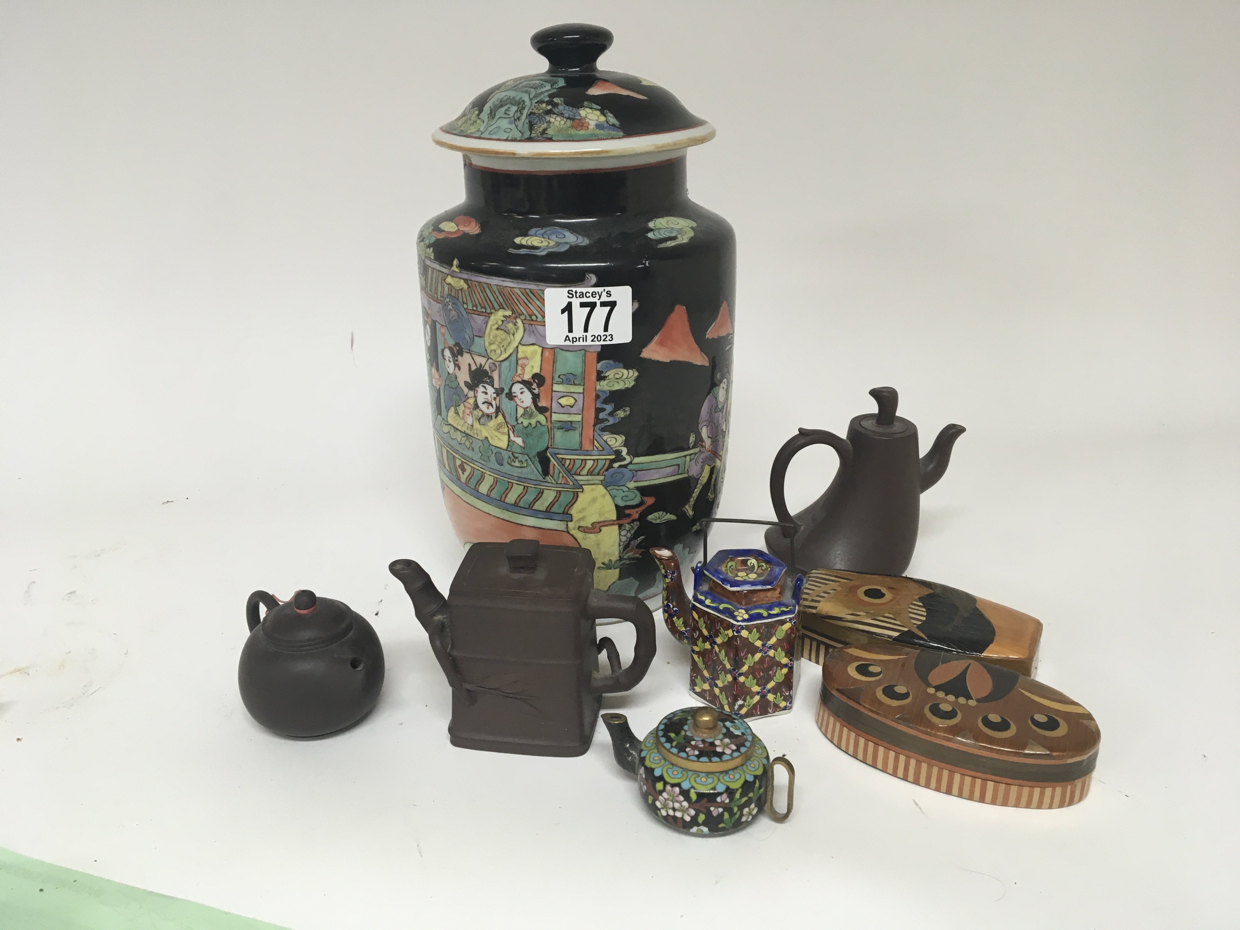 A 20th century Chinese export noir porcelain vase and cover decorated with figures Chinese terracotta tea pots and a Chinese framed embroidered pannela lot)