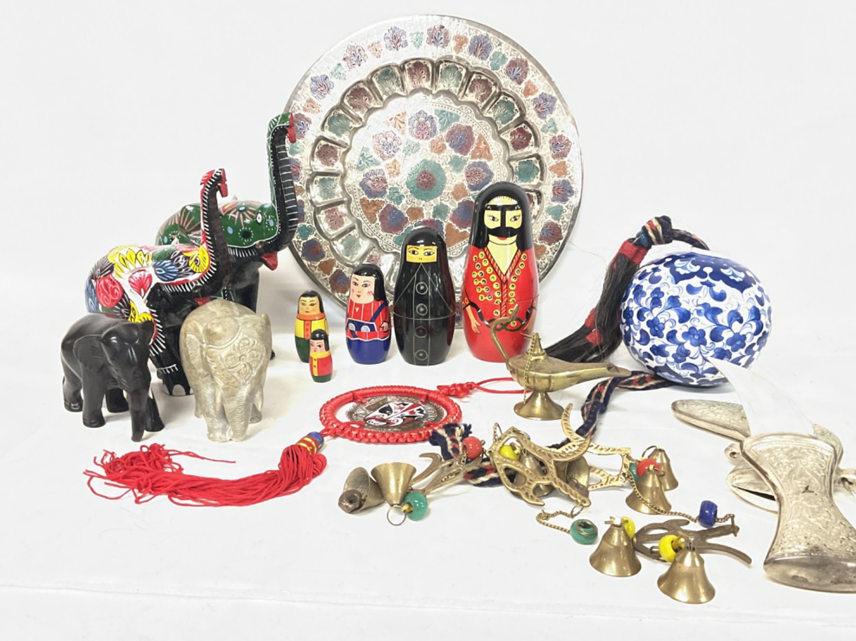 Modern Middle Eastern ornaments consisting of elephant figures, a Kutahya Turkish ceramic ball, a Jambiya dagger and other ornaments, postage category D