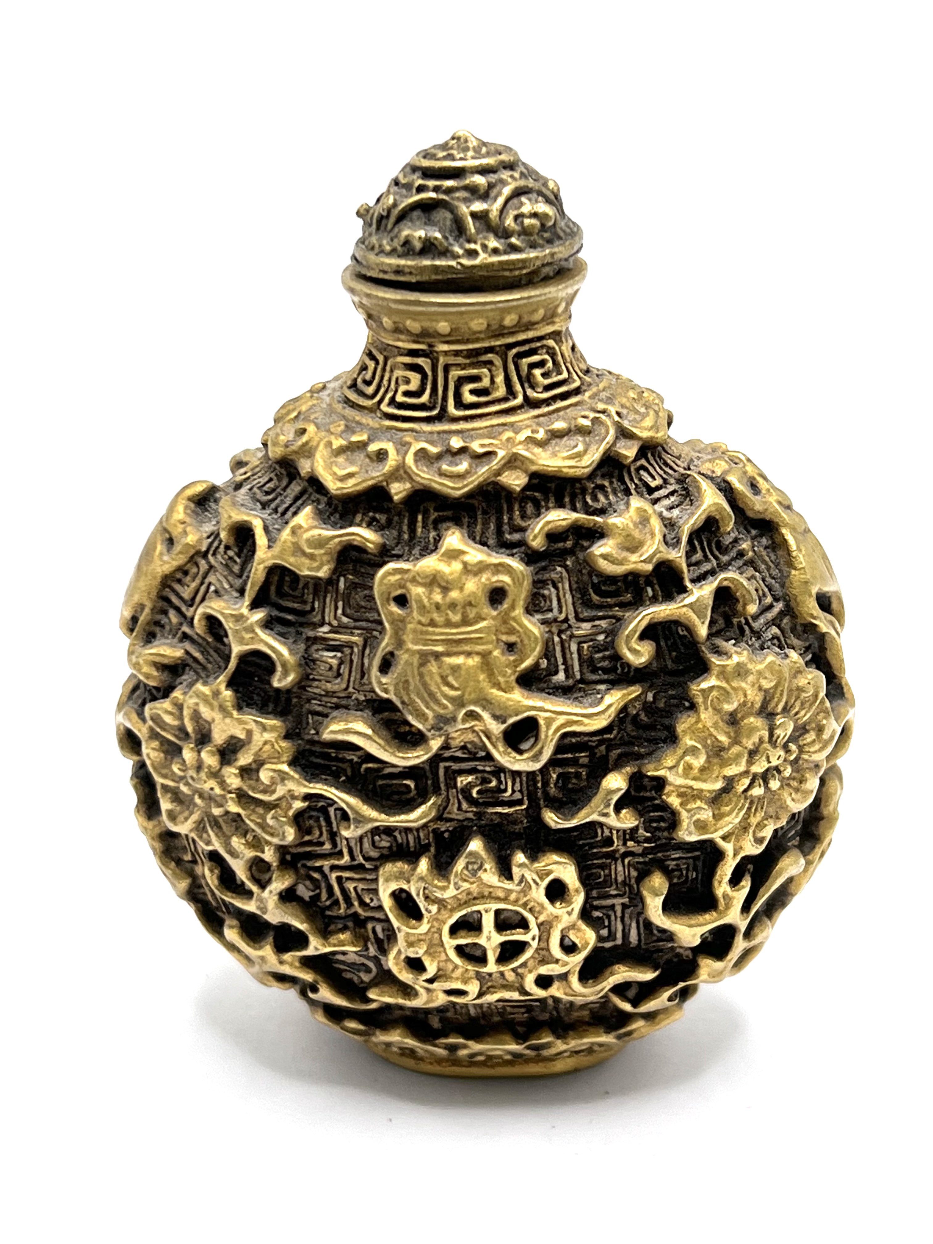 A cast gilt bronze snuff bottle with decoration in the form of Buddhist symbols. Height 7cm.