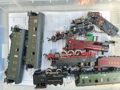 4 Boxes Containing 00 And H0 Locos, wagon's, spare parts etc.