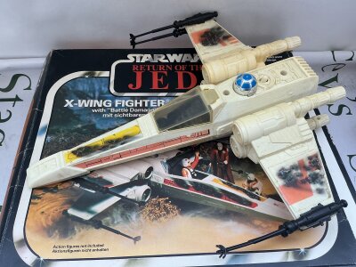a Boxed Vintage Star Wars Battle Damaged X-Wing Fighter.