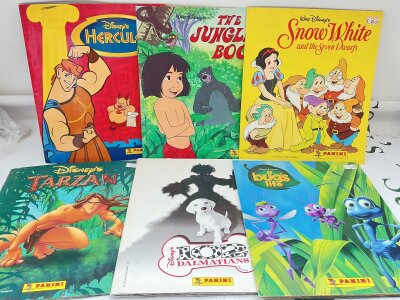 A Collection Of Vintage Disney Sticker Books.