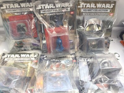 A Collection Of Star Wars The Helmet Collection And Vehicles.