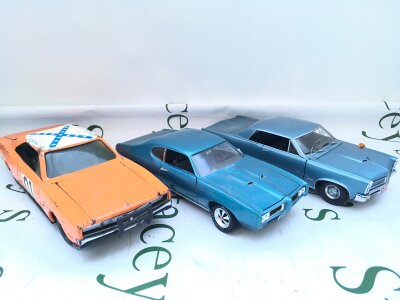 A  Ertl 1/18 Scale Tinplate General Lee, A Sun Star 1965 Pontiac GTO And A Ertl 1959 Pontiac. No Reserve, From A Lifetime Private Collection To Be Sold.