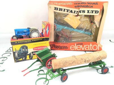 A Boxed Britains Fordson Super Major Diesel Tractor, A Lister Elevator (Box Is Worn)  A Loose Farm Cart And A Timber Trailer.