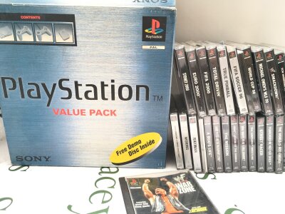A Boxed PlayStation 1 With 2 Controllers And A Collection Of Games. No Reserve.