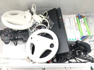 A Box Containing A Nintendo Wii And A Sony Ps3 With Games And Accessories. No Reserve.