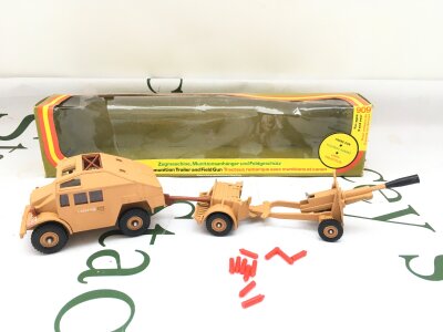 A Boxed Corgi Quad Tractor, Ammunition Trailer And Field Gun. Box Has Damage. No Reserve.