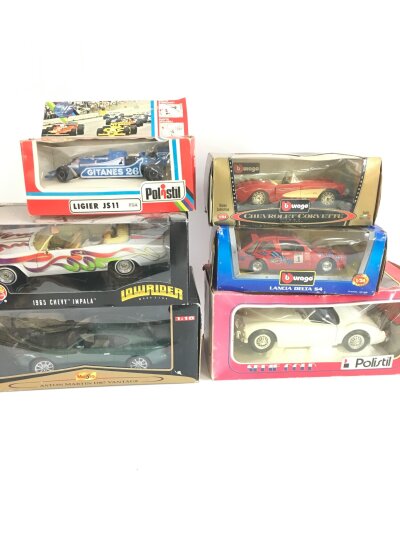A Collection Of Boxed Diecast At Different Scales, Including Hotwheels, Burago, Polistil, Maisto Etc.