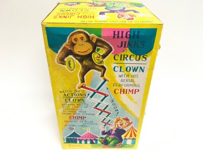 A Boxed Cragstan Tin And Plush High Jinks At The Circus Cown With His Aerial Performing Chimp.