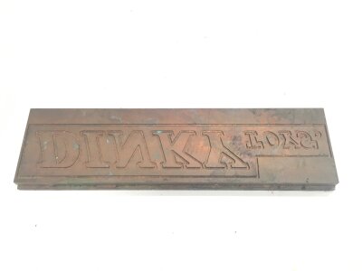 A Vintage Dinky Toys Letter Press. Approximately 19X5CM.