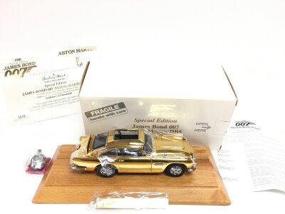 A Boxed Danbury Mint James Bond Aston Martin DB5 1/24 Scale, Gold Plated.