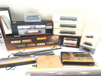 A Collection Of Boxed Marklin Z Gauge Wagons, coaches, track And Building.