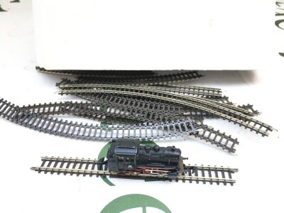 A Loose z Gauge Locomotive With Track.