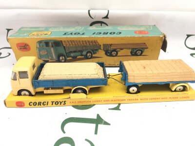 A Boxed Corgi Gift Set #11 A E.R.F. Dropside Lorry And Platform Trailer With Cement And Plank Loads. Box Is Worn.