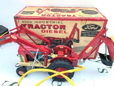 A Boxed Vintage Tin Battery Operated Cragstan Corp Ford 4000 Industrial Tractor. No Reserve.