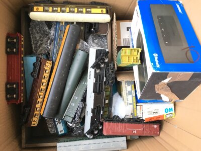 A Box Containing 00 Gauge Coaches, wagons etc. No Reserve.