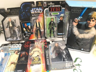 A Collection Of Boxed And Carded Star Wars Figures Including 50th Anniversary Figures. No Reserve.
